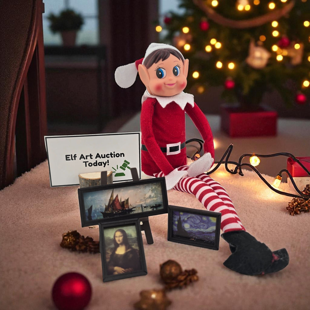 Christmas elf doll sitting next to miniature framed paintings and an Elf Art Auction sign from the 24 day elf kit.